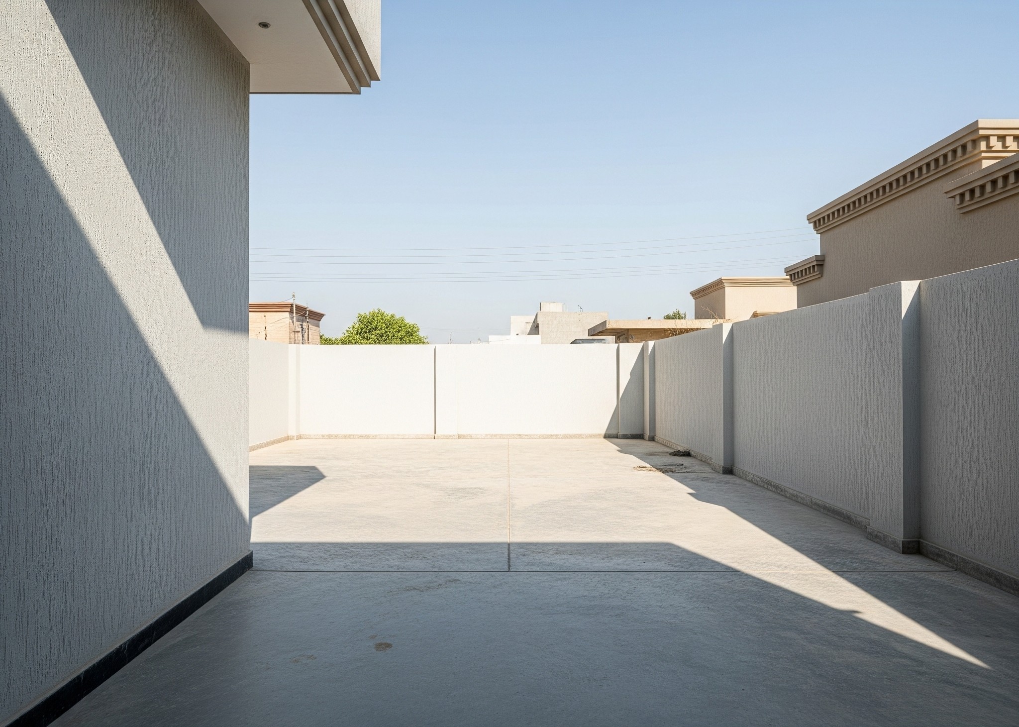 Before pergola installation: An empty outdoor space in Karachi, awaiting a shaded seating solution.