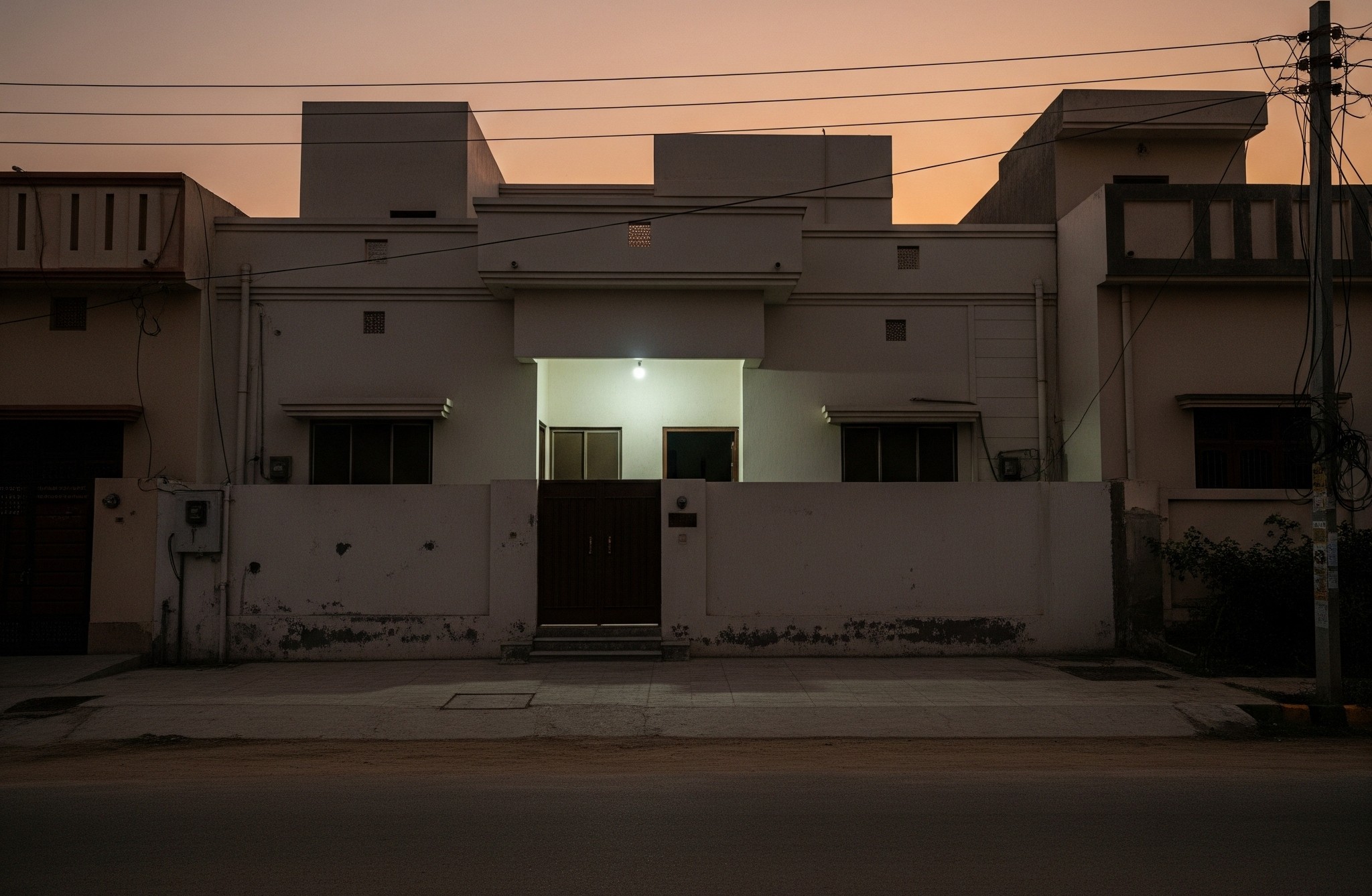 Before facade renovation: A plain or dated building exterior in Karachi, awaiting modern cladding.