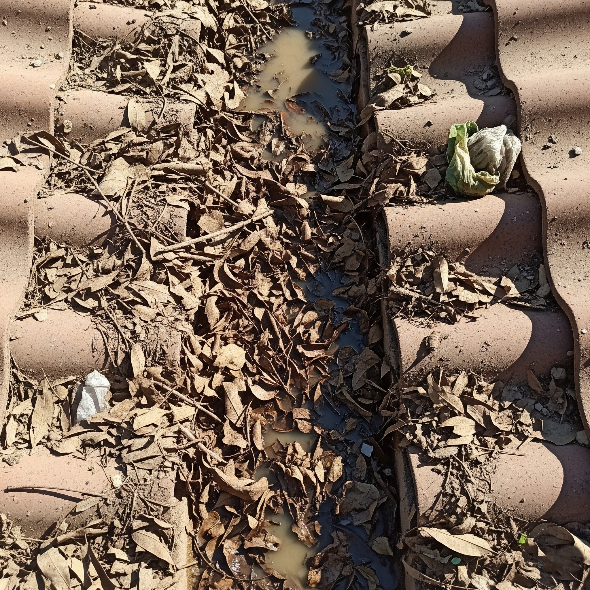 Before `gutter guard installation Karachi`: A basic gutter system prone to clogging.